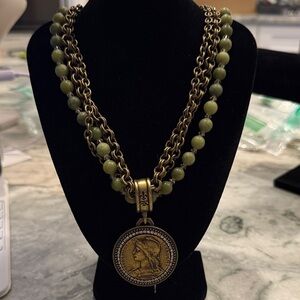 Elegant Green and Gold Necklace with Medallion Pendant